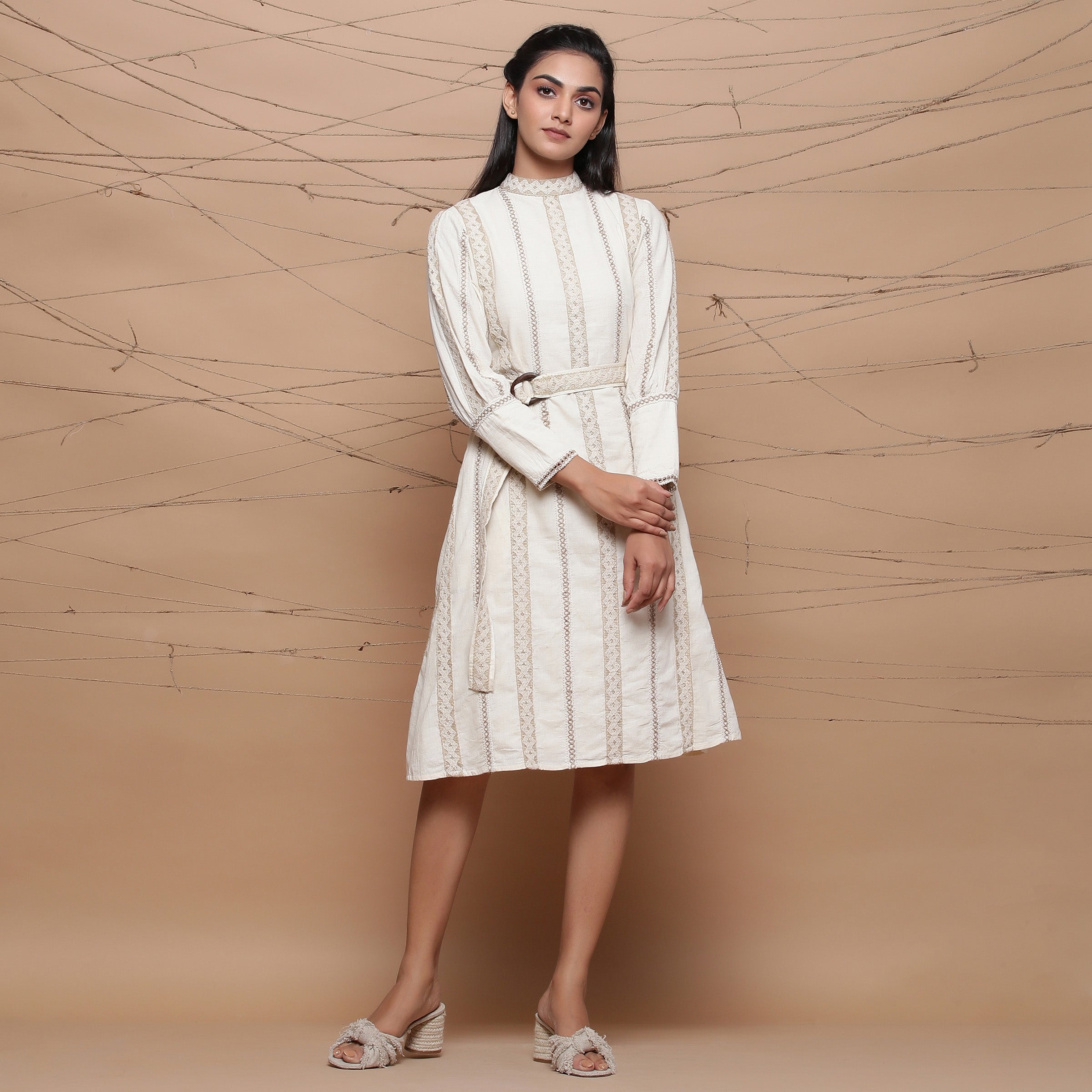 Front View of a Model wearing Undyed Jute Laced Turtle Neck Dress