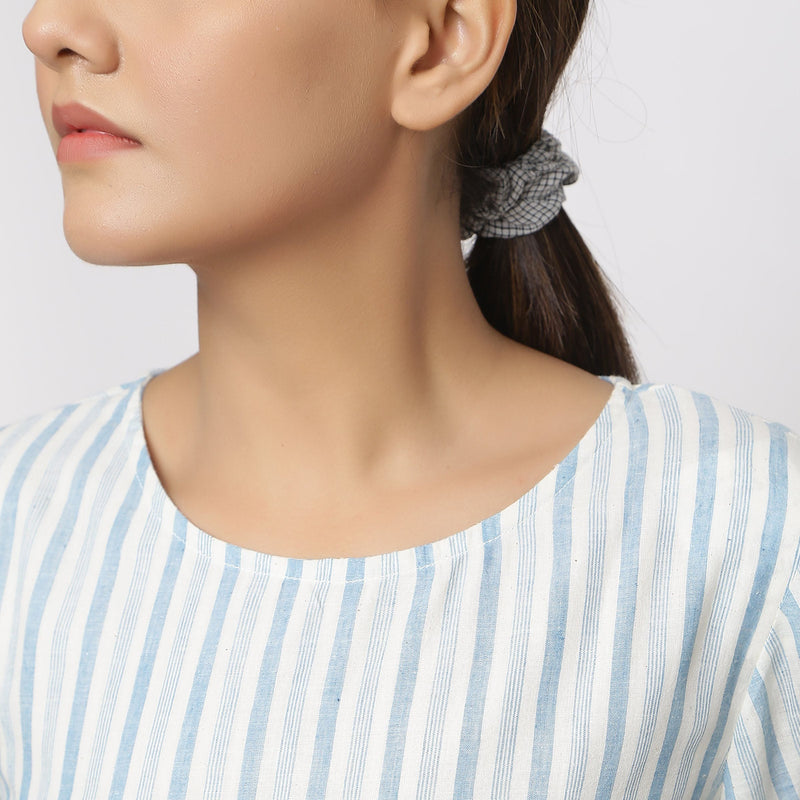 Front Detail of a Model wearing Off-White Handspun Cotton Muslin Dress