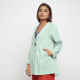 Left View of a Model wearing Aqua 100% Cotton Flared Short Jacket