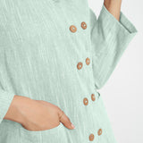 Front Detail of a Model wearing Aqua Cotton Flax Button-Down Jacket