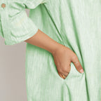 Right Detail of a Model wearing Aqua Lapel Collar Cotton Overlay