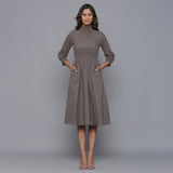 Front View of a Model wearing Ash Grey Flannel High Neck Midi Dress