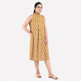 Right View of a Model wearing Mustard Bagru Block Print Pleated Cotton Midi Dress