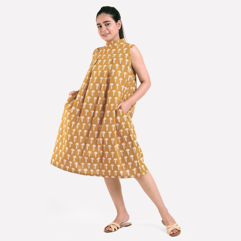 Front View of a Model wearing Mustard Bagru Block Print Pleated Cotton Midi Dress