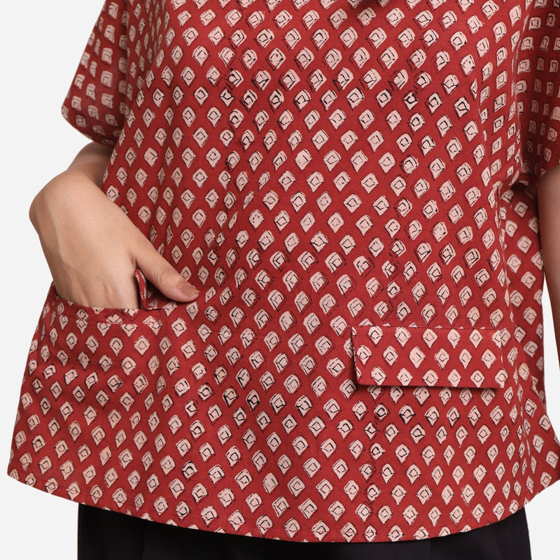 Front Detail of a Model wearing Brick Red Block Print Flared Round Neck Cotton Top