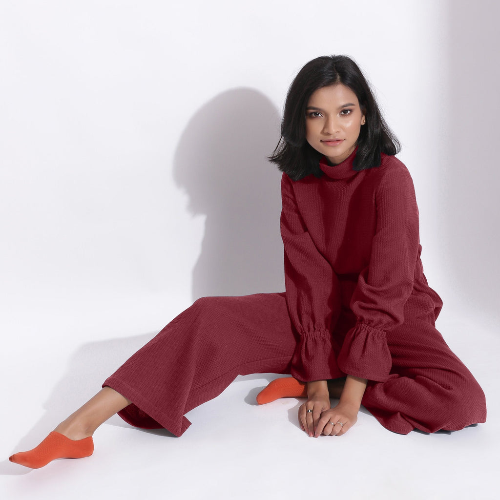 Front View of a Model wearing Barn Red Cotton Waffle Turtle Neck Overalls