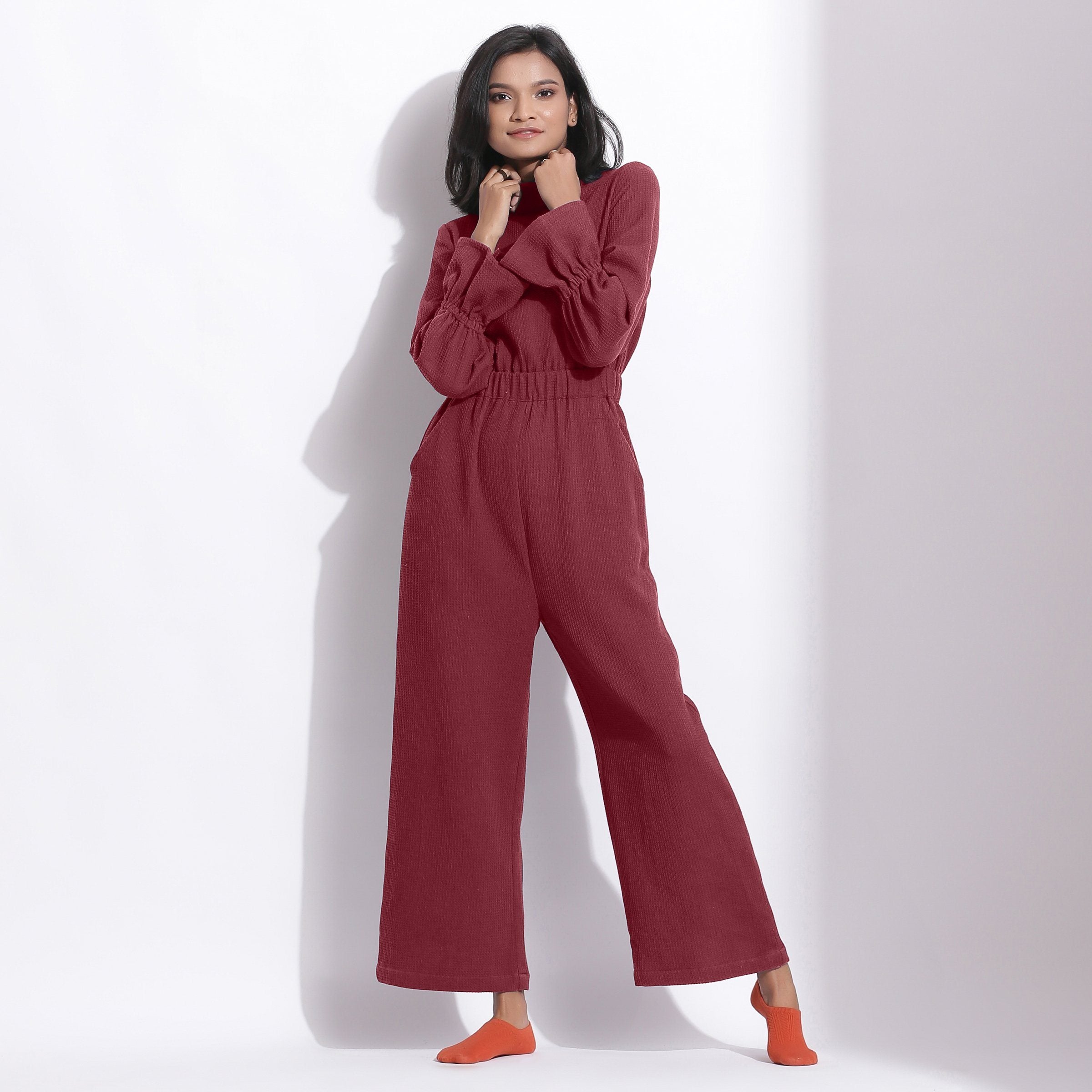 Front View of a Model wearing Barn Red Cotton Waffle Turtle Neck Overalls