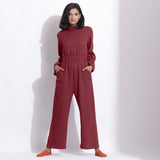 Front View of a Model wearing Barn Red Cotton Waffle Turtle Neck Overalls