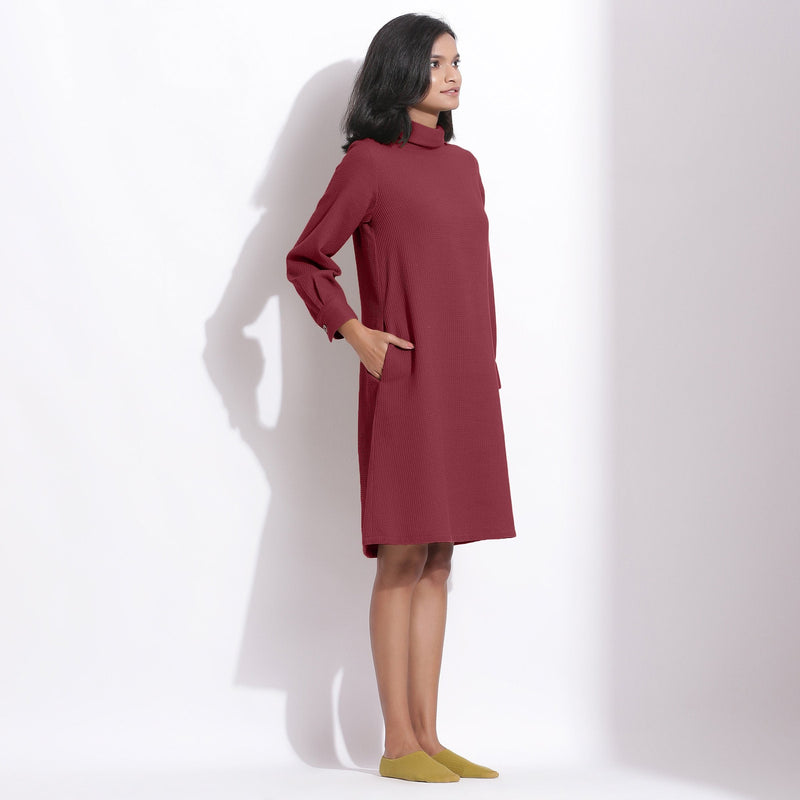 Right View of a Model wearing Barn Red Cotton Waffle Turtleneck Dress