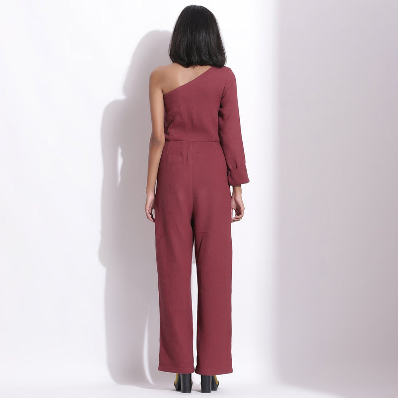 Back View of a Model wearing Barn Red Honeycomb One-Shoulder Jumpsuit
