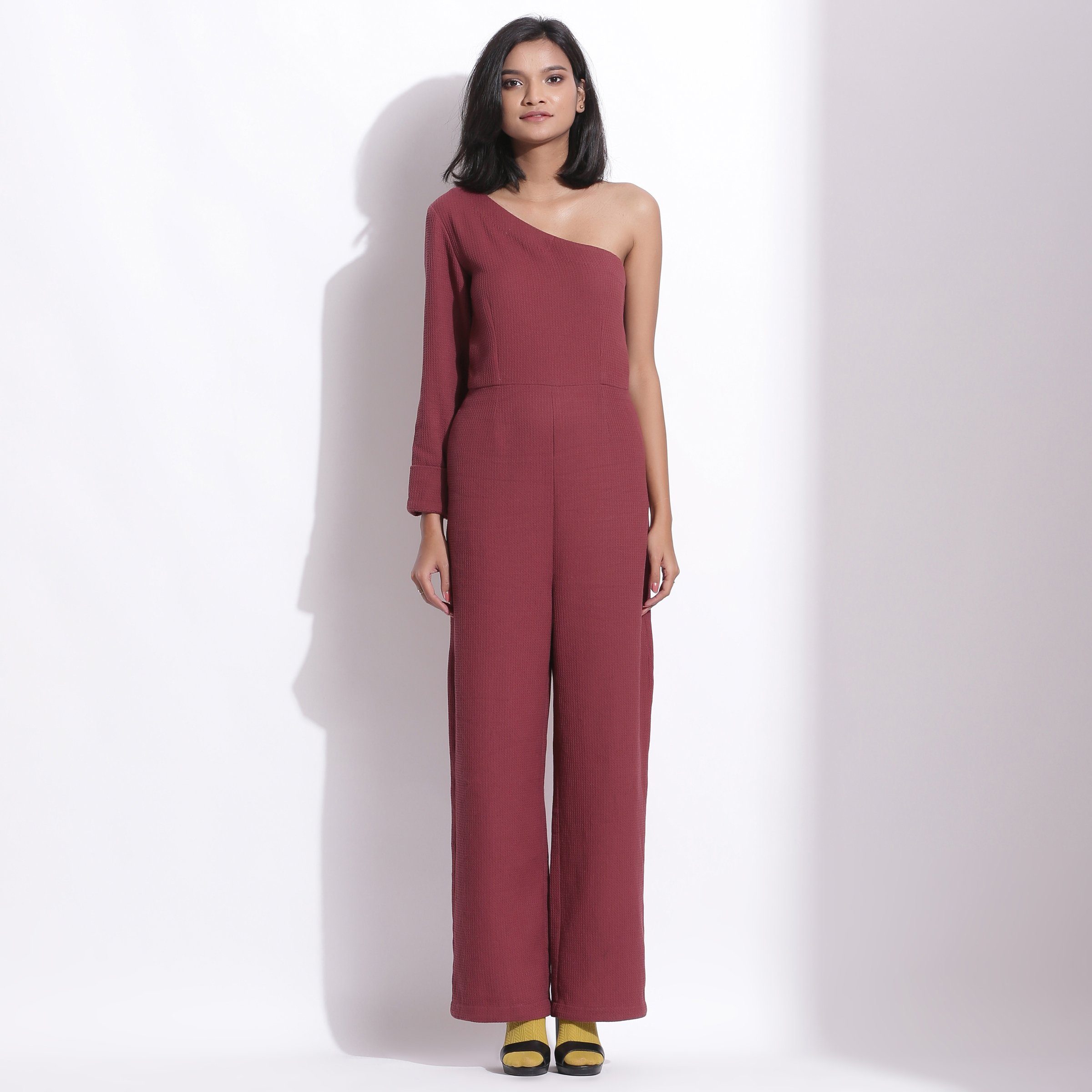 Front View of a Model wearing Barn Red Honeycomb One-Shoulder Jumpsuit