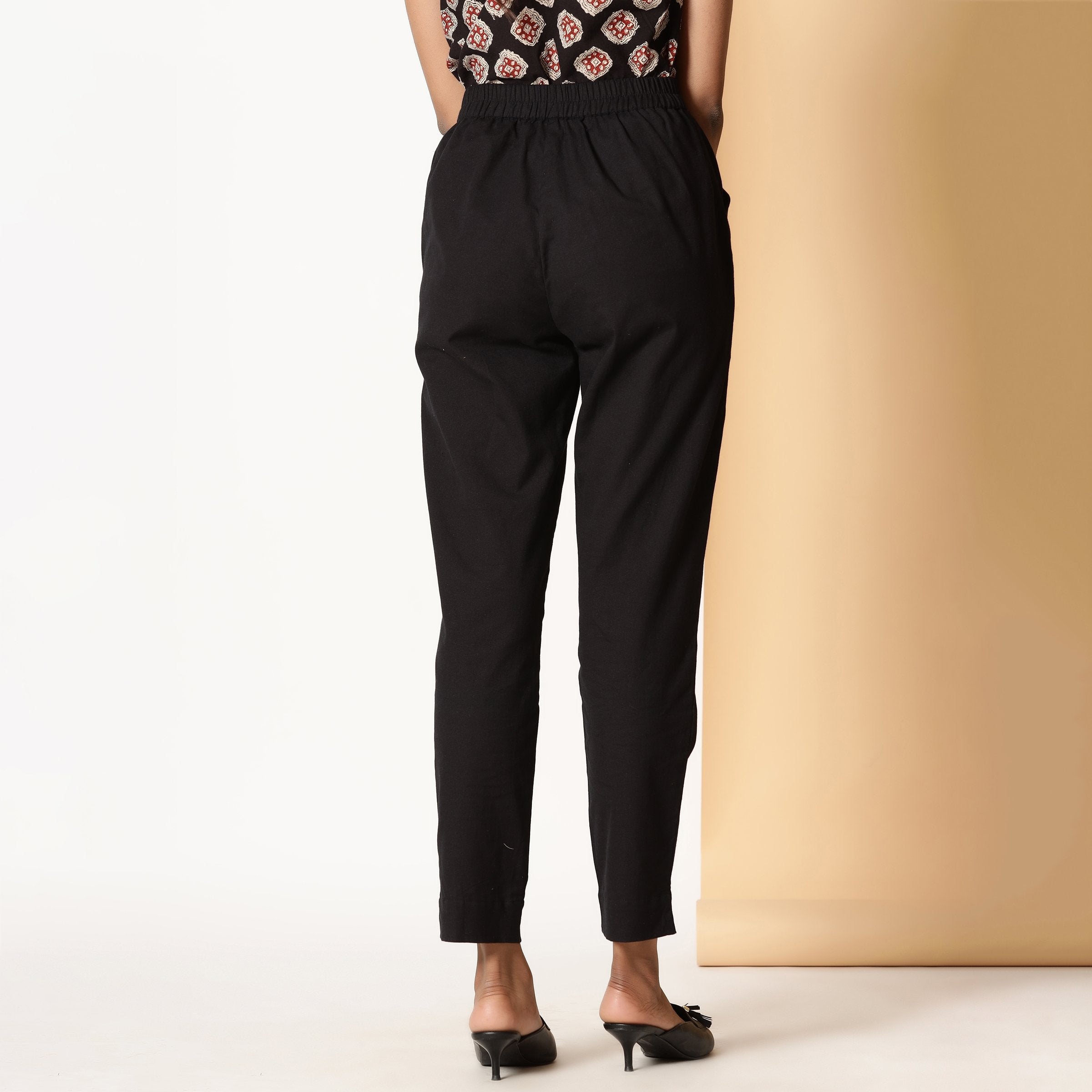 Back View of a Model wearing Basic Black Comfy Cotton Flax Tapered Pant
