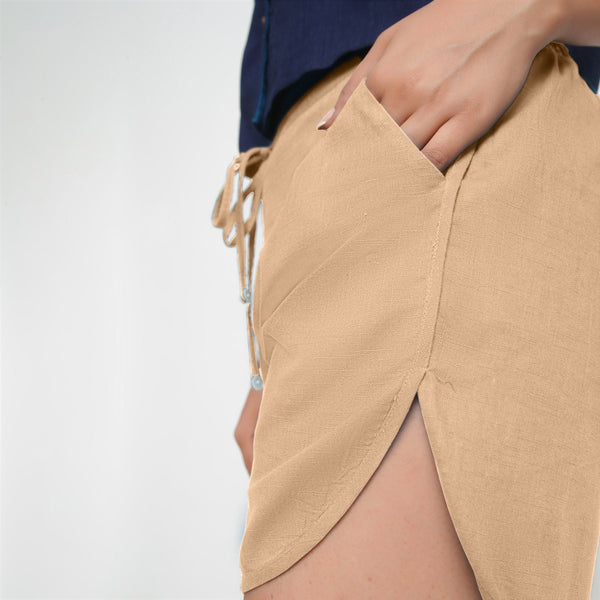 Left View of a Model wearing Beige 100% Cotton Low-Rise Short Shorts