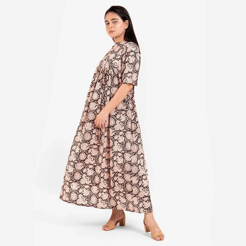 Left View of a Model wearing Beige Bagru Block Print Cotton Flared Maxi Dress