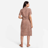 Back View of a Model wearing Beige Block Printed Cotton Midi Shift Dress