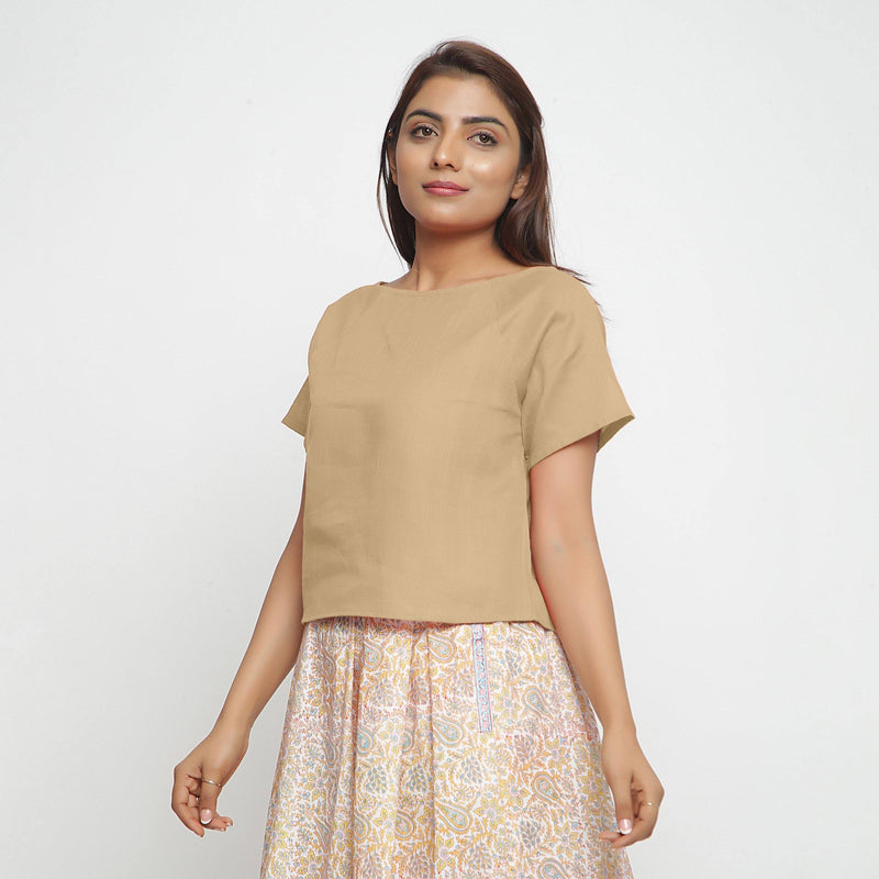Front View of a Model wearing Beige Boat Neck Half Sleeve Cotton Top