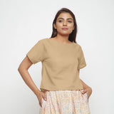 Front View of a Model wearing Beige Boat Neck Half Sleeve Cotton Top
