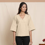 Front View of a Model wearing Beige Comfy Straight Top