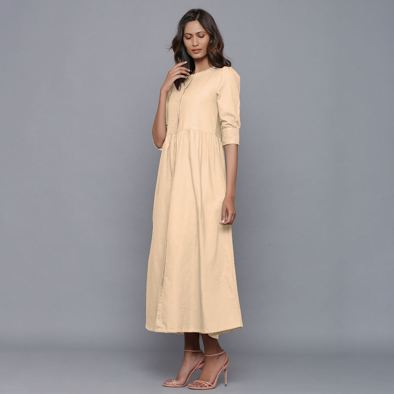 Left View of a Model wearing Beige Cotton Flannel Gathered Dress
