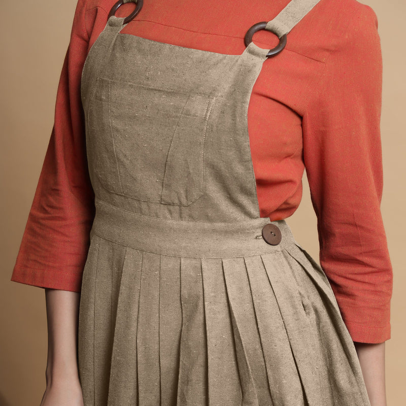 Front Detail of a Model wearing Beige Pleated Cotton Flax Knee Length Criss-Cross Back Dress