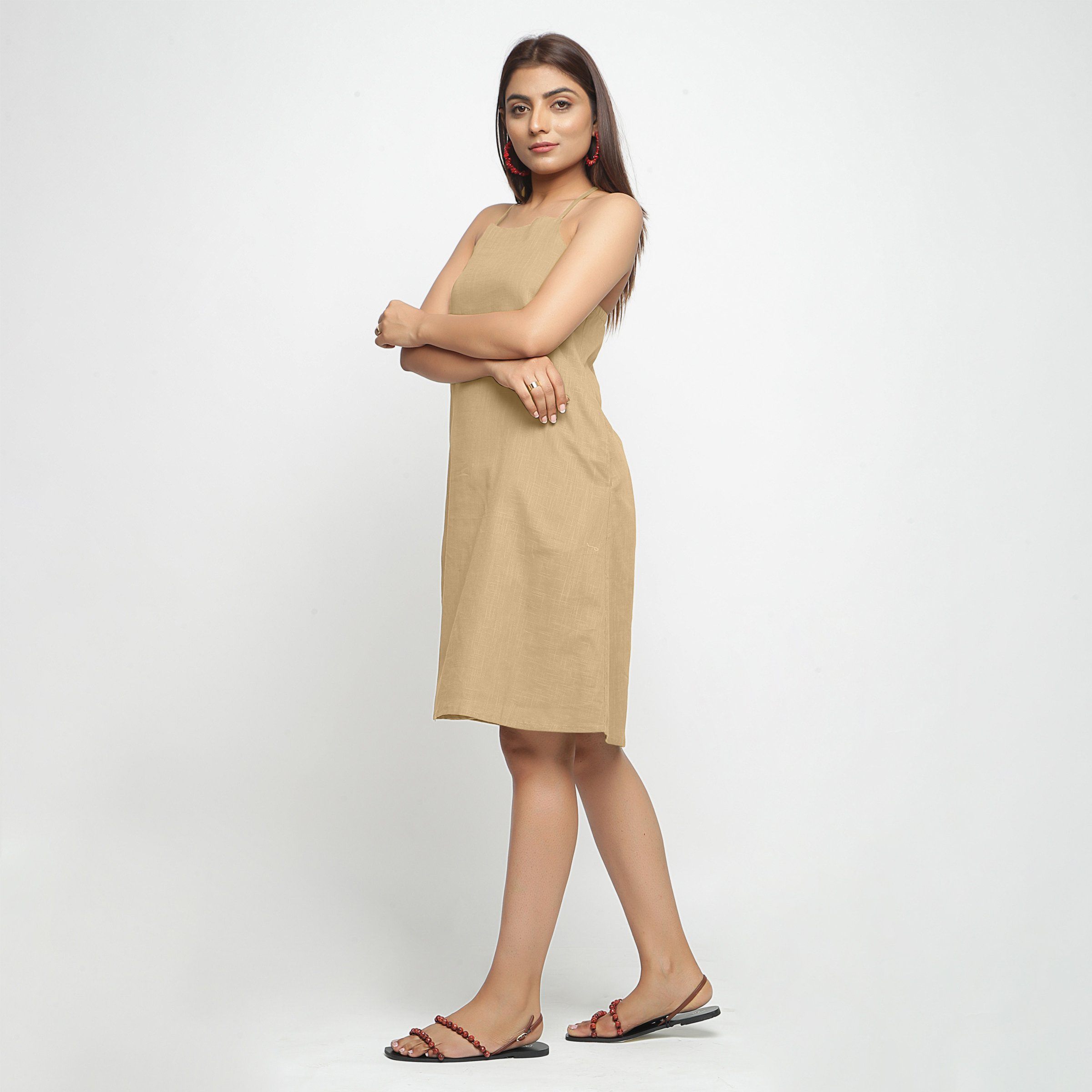 Left View of a Model wearing Beige Criss-Cross Cotton A-Line Dress