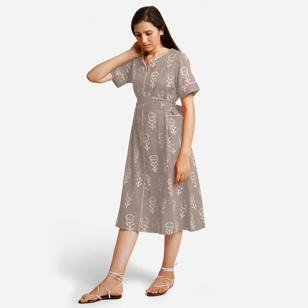 Left View of a Model wearing Beige Dabu Block Print A-Line Midi Dress