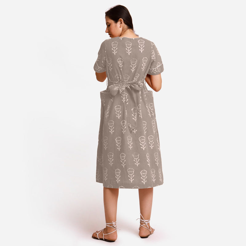 Back View of a Model wearing Beige Dabu Block Print A-Line Midi Dress