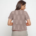 Back View of a Model wearing Beige Dabu Print Relaxed Sleeves Button-Down Top
