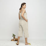 Back View of a Model wearing Beige Dabu Printed Button-Down Jumpsuit