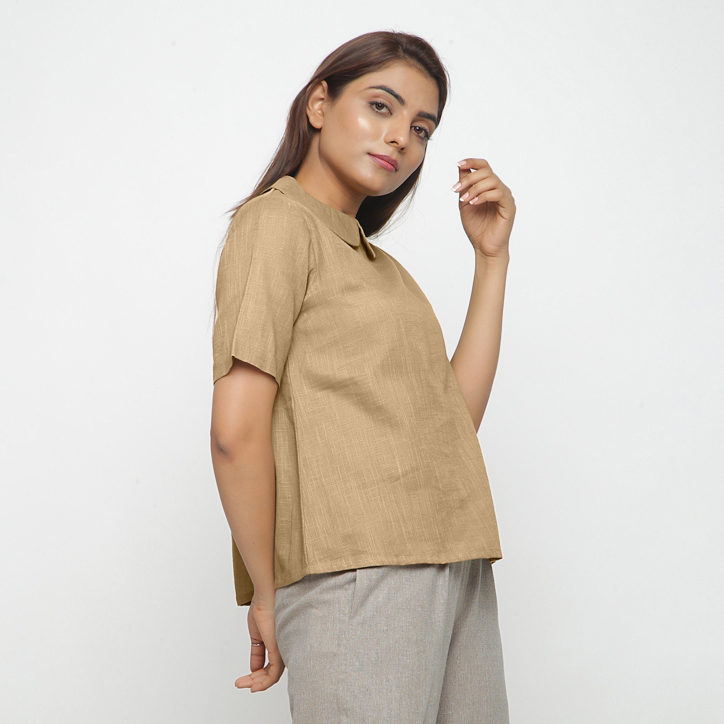 Right View of a Model wearing Beige Everyday Essential A-Line Top