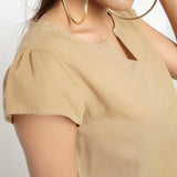 Front Detail of a Model wearing Beige Puff Sleeves Cotton A-Line Top