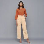 Front View of a Model wearing Beige Flannel Rolled-Up Straight Pant
