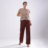 Front View of a Model wearing Beige Block Print Floral Loose Fit Top