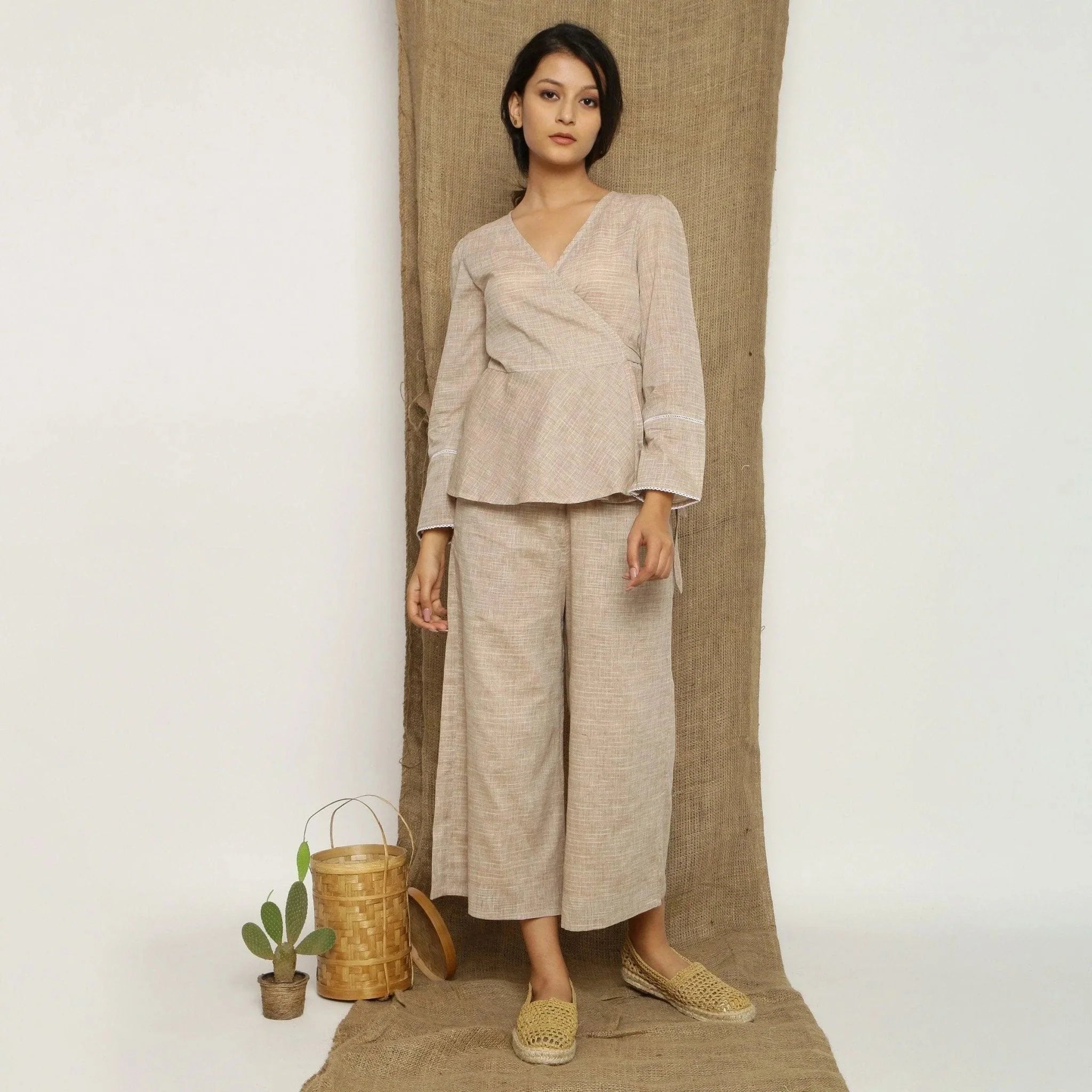 Front View of a Model wearing Beige Handspun Full Sleeve V-Neck Wrap Top