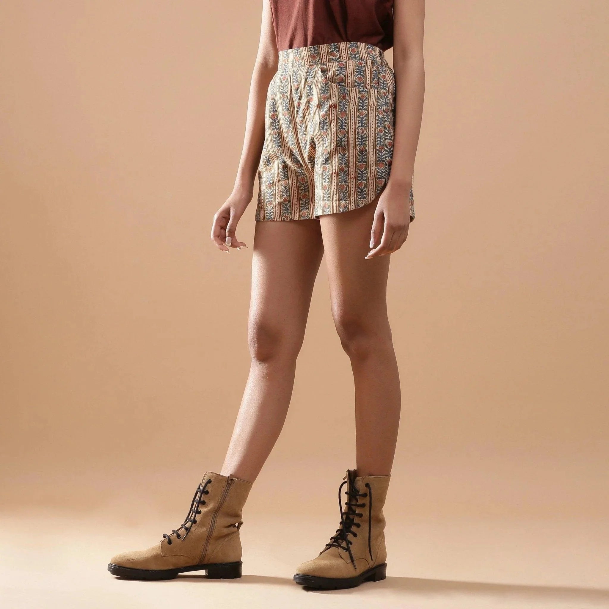 Left View of a Model wearing Beige Kalamkari Comfort Fit Shorts