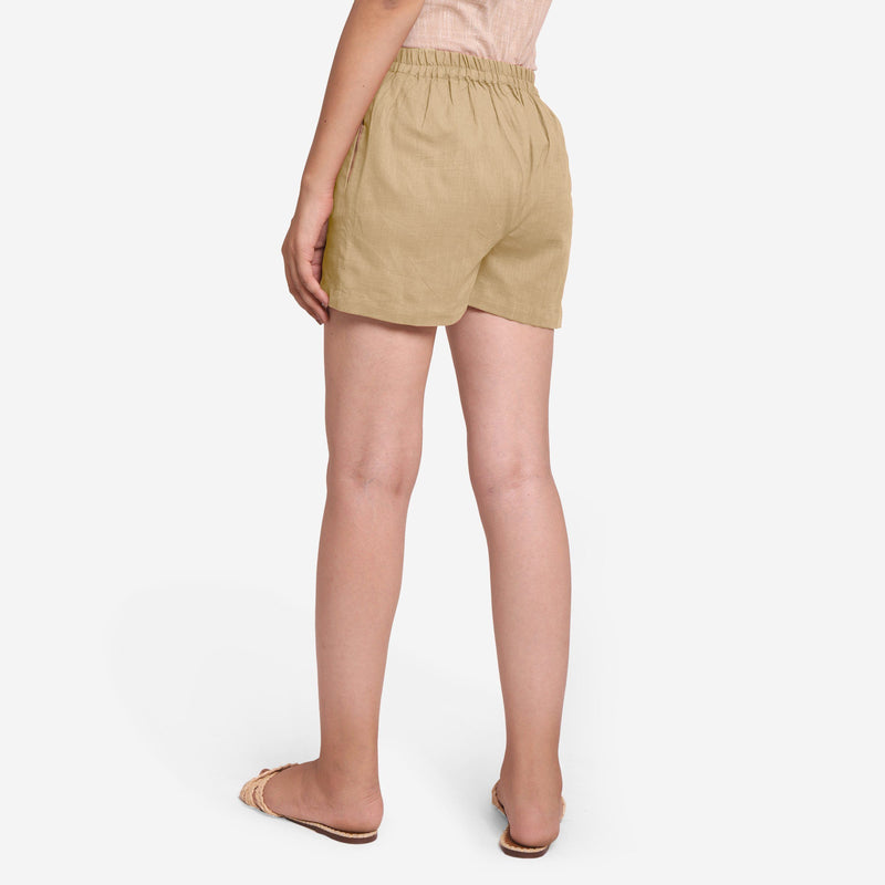 Back View of a Model wearing Beige Mid-Rise Cotton Straight Shorts
