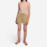 Front View of a Model wearing Beige Mid-Rise Cotton Straight Shorts