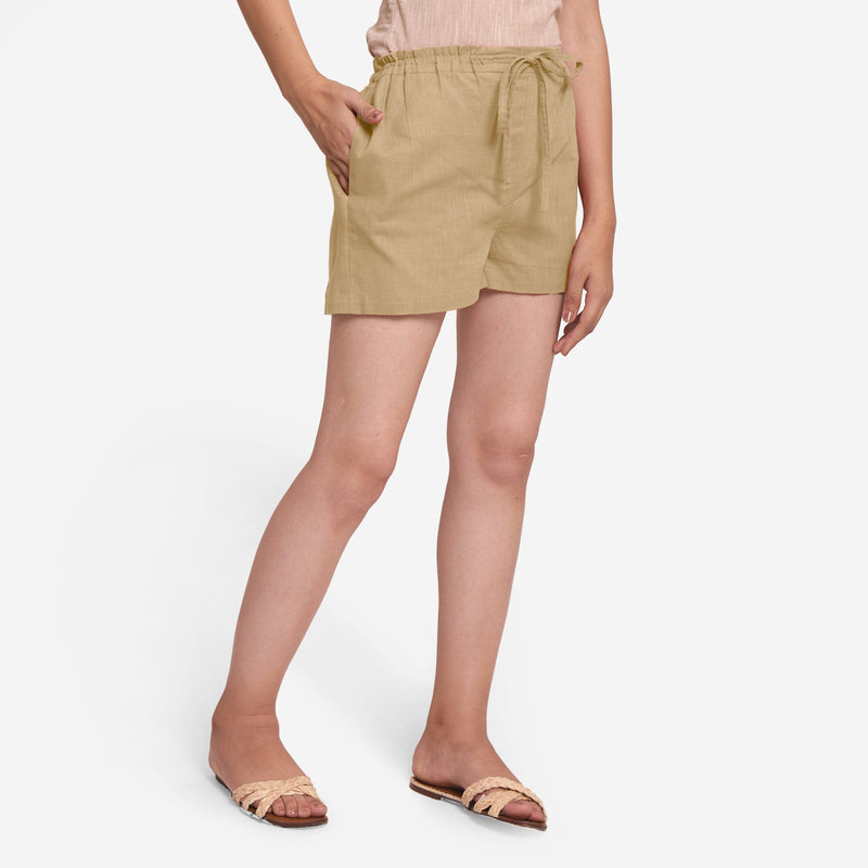 Right View of a Model wearing Beige Mid-Rise Cotton Straight Shorts