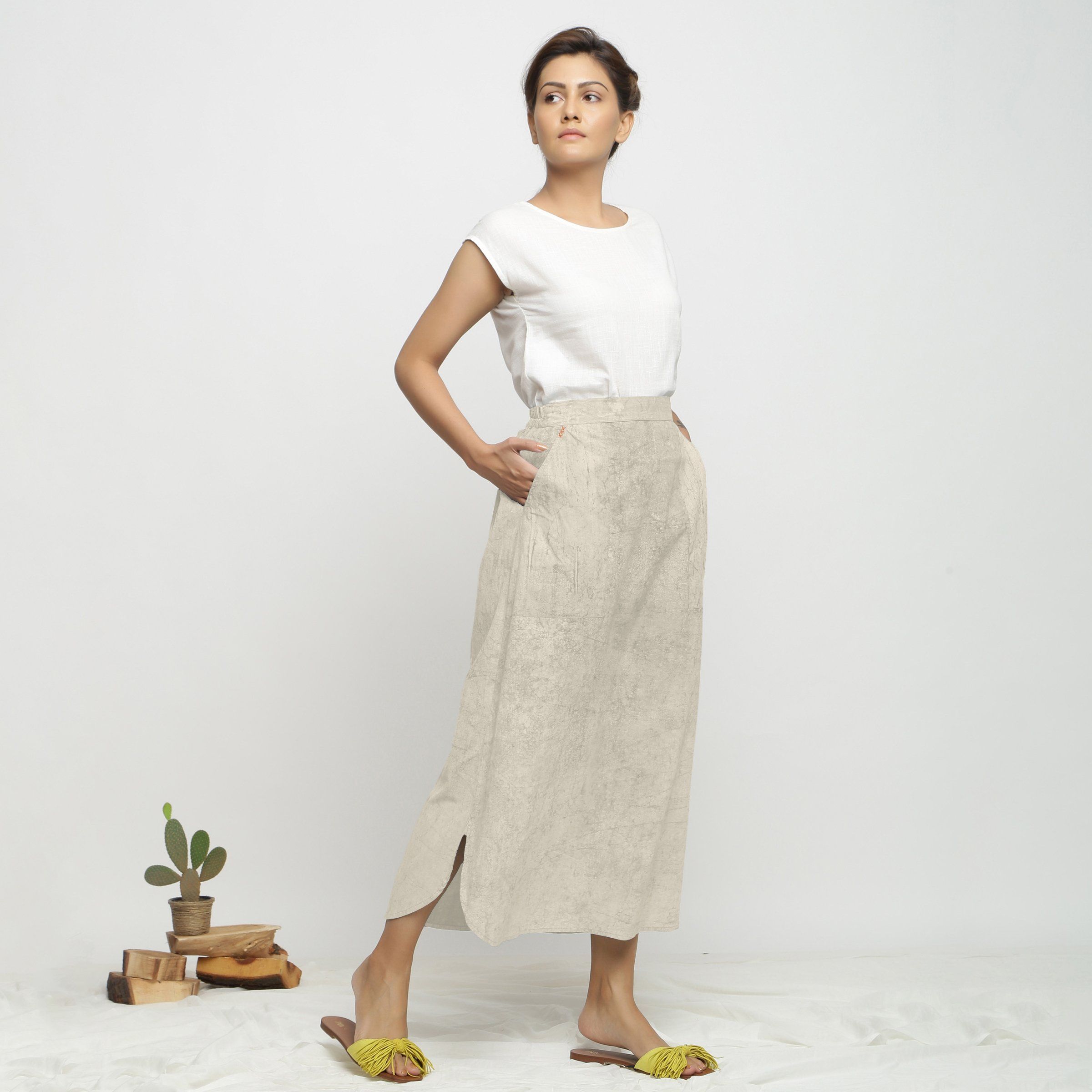 Right View of a Model wearing Beige Printed Breezy Blue A-Line Skirt