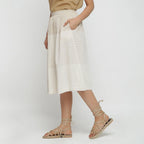 Left View of a Model wearing Striped Pleated High-Rise Paneled Skirt