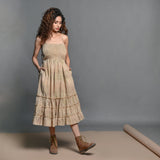 Front View of a Model wearing Beige Striped Handwoven Cotton Boho Tier Dress