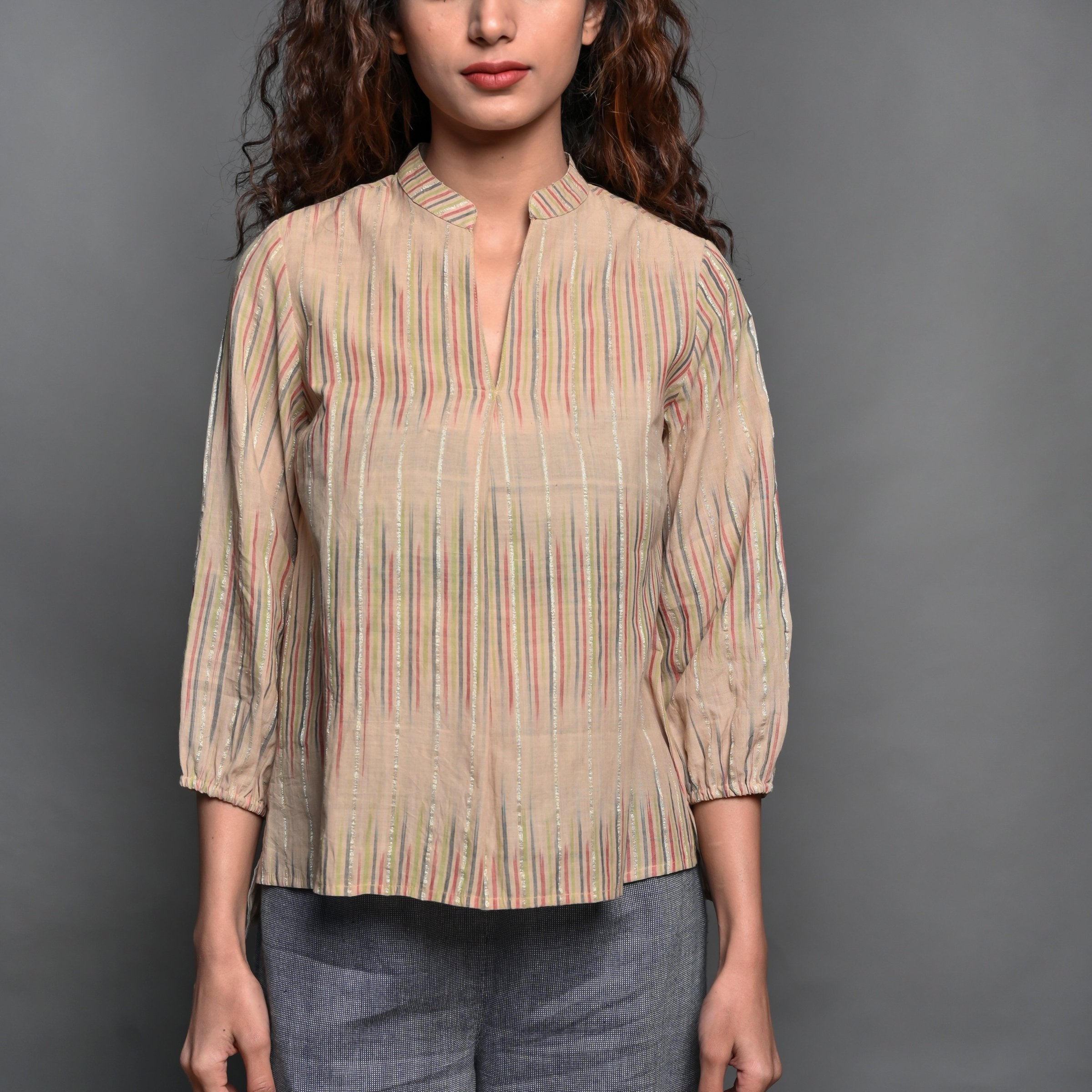 Front Detail of a Model wearing Beige Striped Handwoven Cotton Split Neck Pleated Shirt