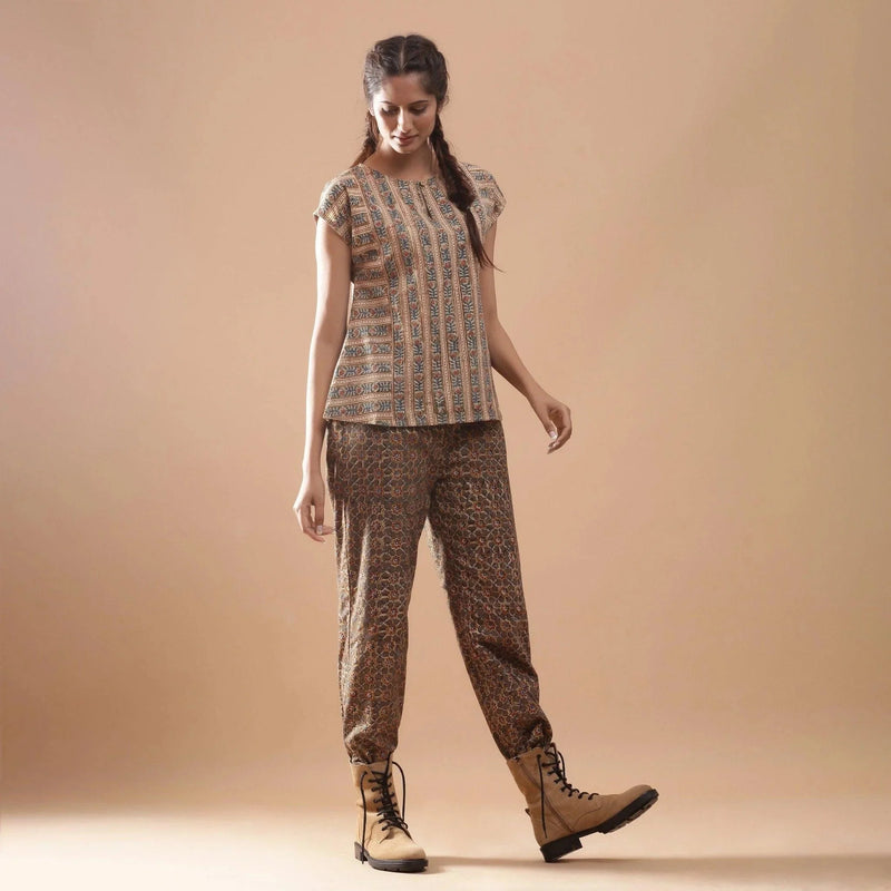 Front View of a Model wearing Beige Kalamkari A-Line Striped Top