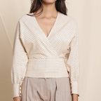 Front Detail of a Model wearing Beige Striped Surplice Neck Cotton Blouson Wrap Top