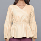 Front Detail of a Model wearing Beige V-Neck Flannel Peplum Top