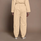 Back View of a Model wearing Beige Warm Cotton Flannel Elasticated High-Rise Jogger Pant