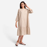 Front View of a Model wearing Beige Yarn-Dyed 100% Cotton Tier Midi Dress