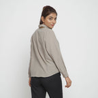 Back View of a Model wearing Beige Yarn Dyed Knife Pleats Top