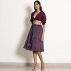 Left View of a Model wearing Berry Wine Striped Frilled Wrap Skirt