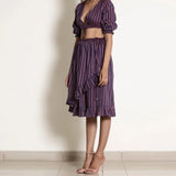 Left View of a Model wearing Berry Wine Striped Frilled Wrap Skirt